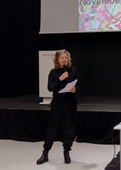 Woman with microphone gives the opening speech at
                                          the event Richard Hawkins in conversation with Christian Liclair